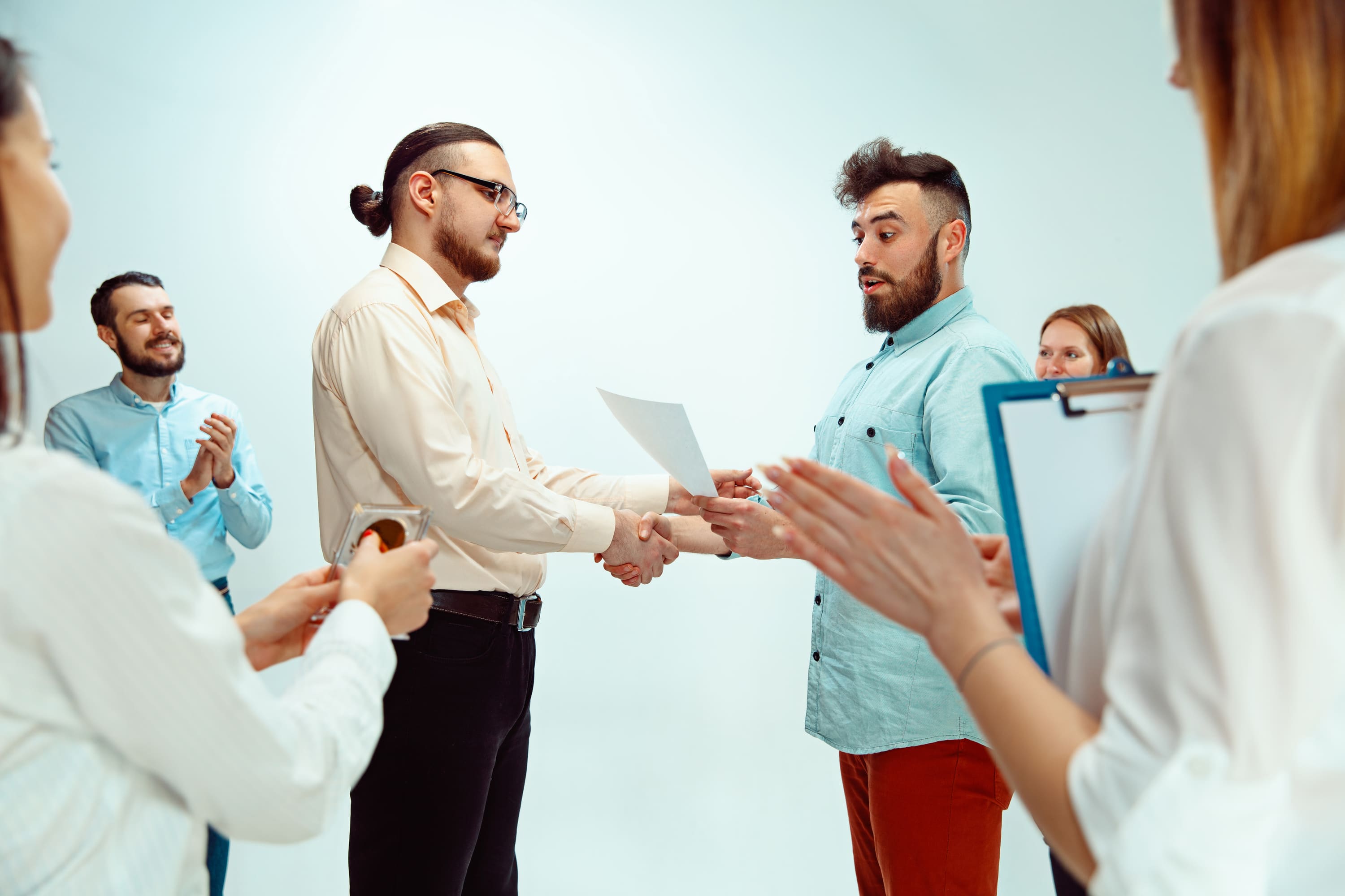 Boss approving and congratulating young successful employee of the company for his successes and good work. National Employee Appreciation Day, businesswoman, businessman, business, success, admire, career growth concept.